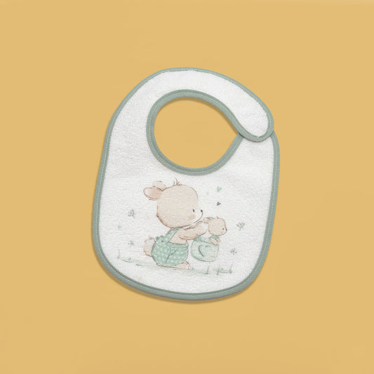 Babero impermeable con motivo de conejito en la cesta verde