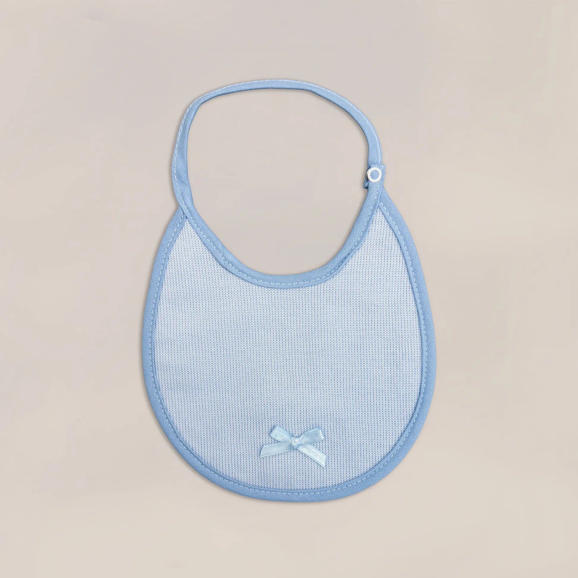 Babero liso con lacito azul