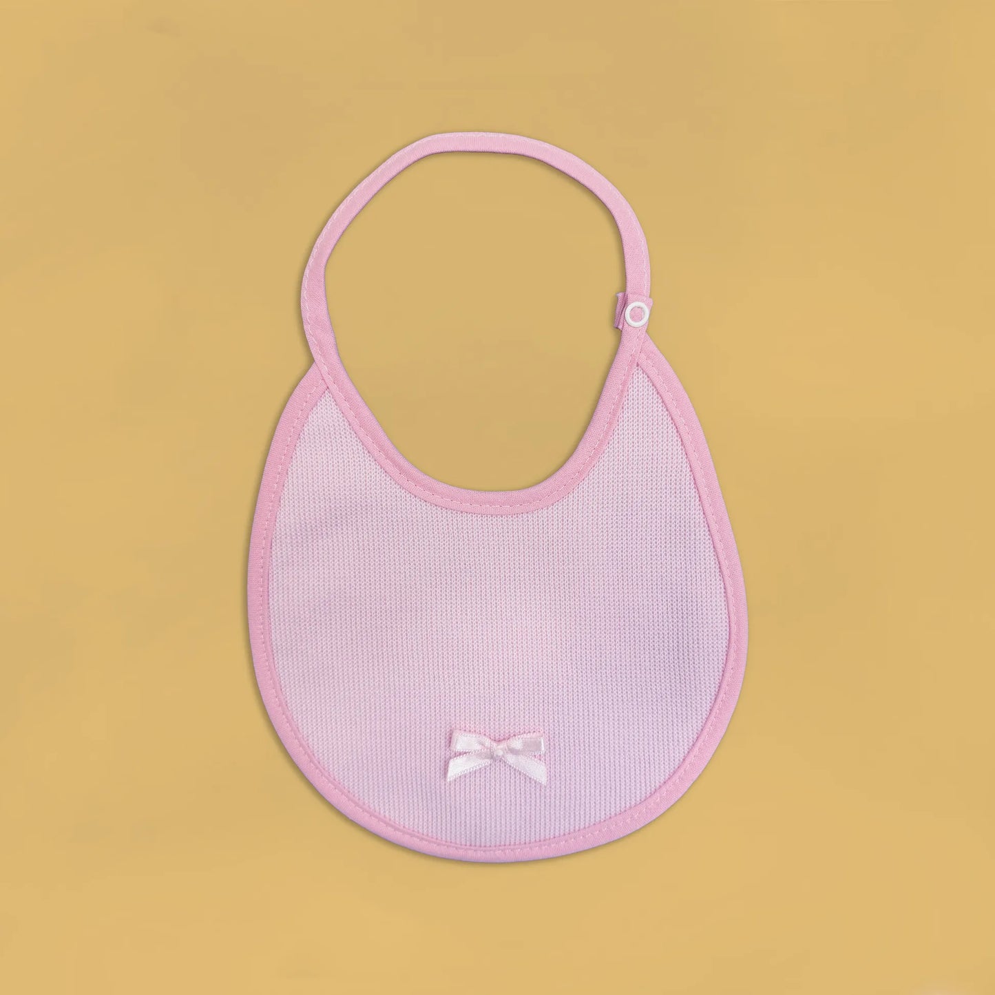 Babero liso con lacito rosa