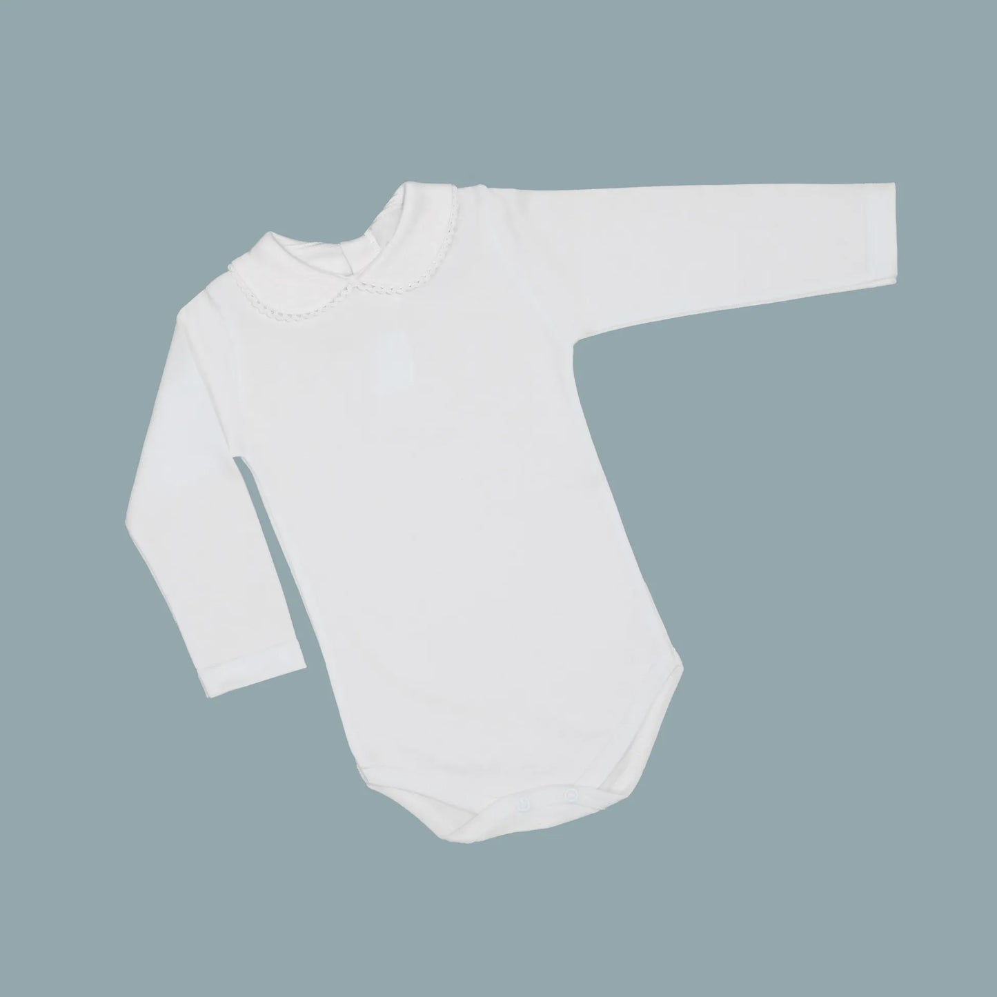 Body de manga larga perchado con aplicación bordada alrededor del cuello blanco