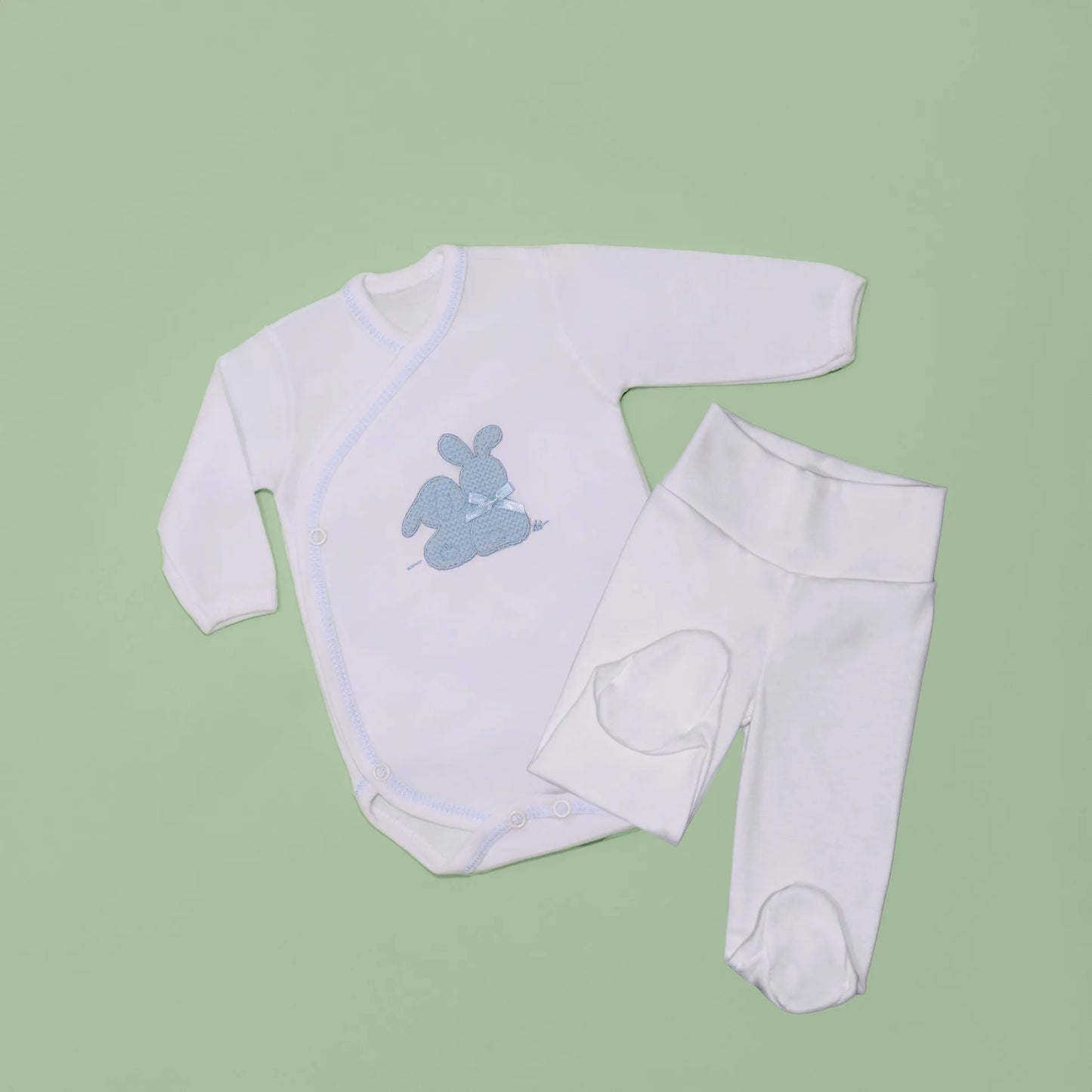 Body cruzado con leotardo perchado con motivo de conejos de punto y lazito azul