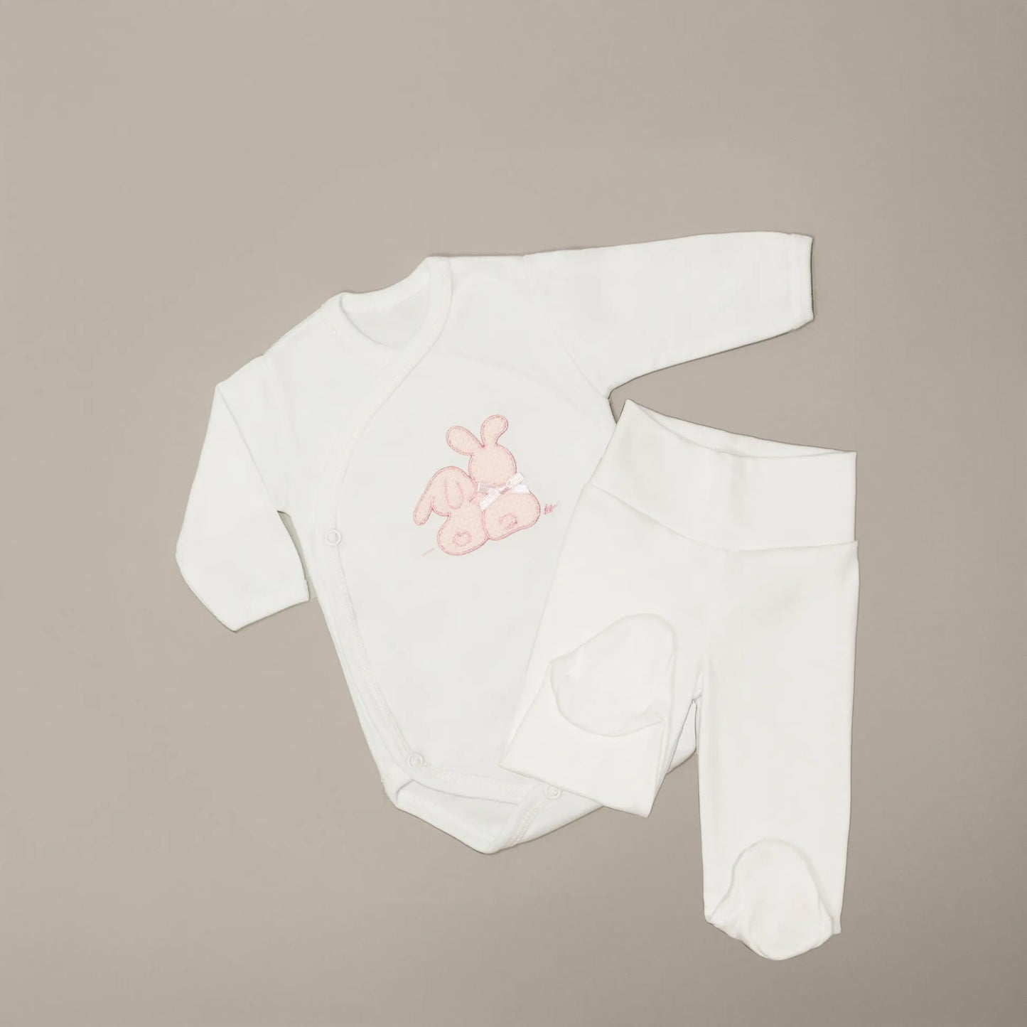 Body cruzado con leotardo perchado con motivo de conejos de punto y lazito rosa