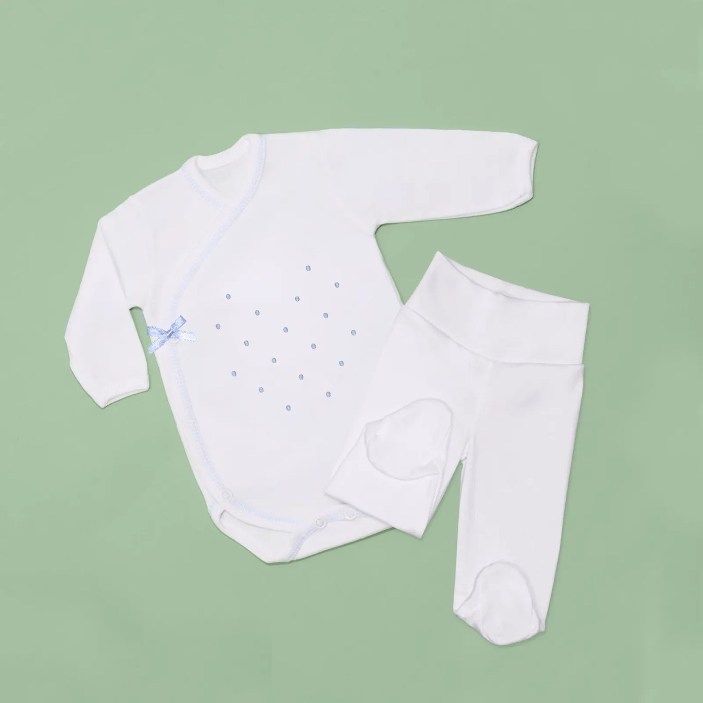 Body cruzado con pantalones com pies con bordado de lunares azul