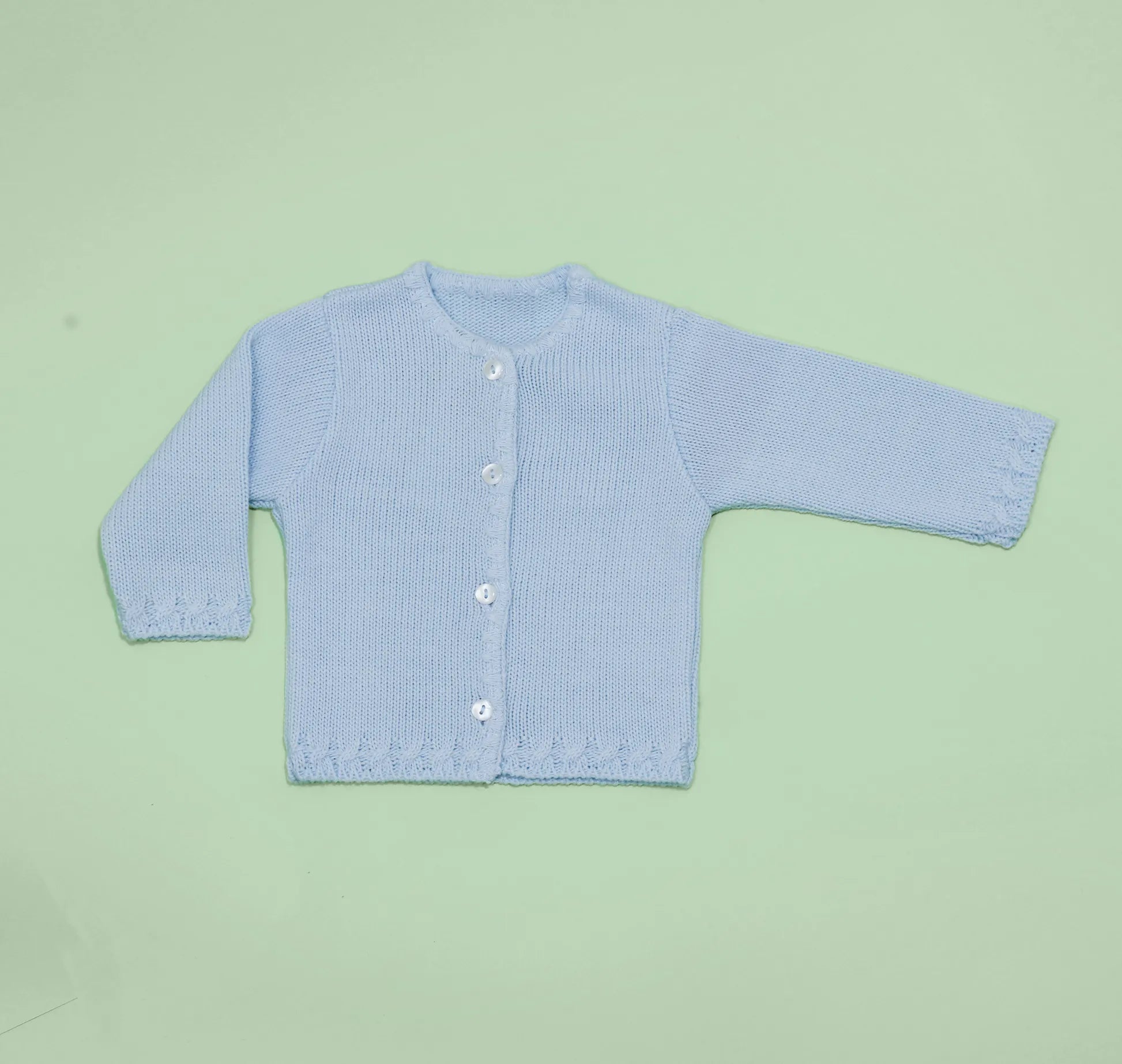 Chaqueta de punto con detalles trabajados en los bordes azul