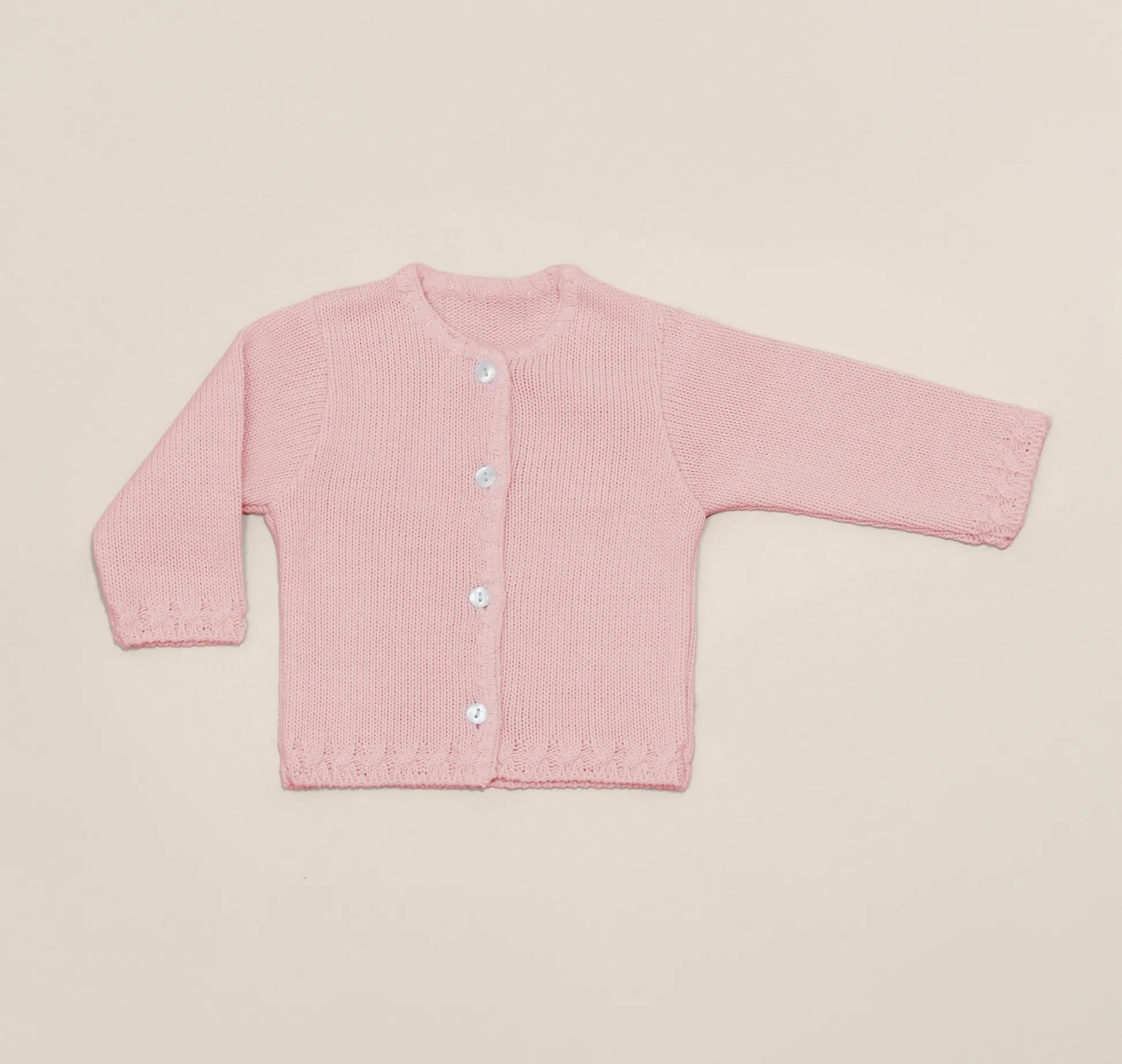Chaqueta de punto con detalles trabajados en los bordes rosa
