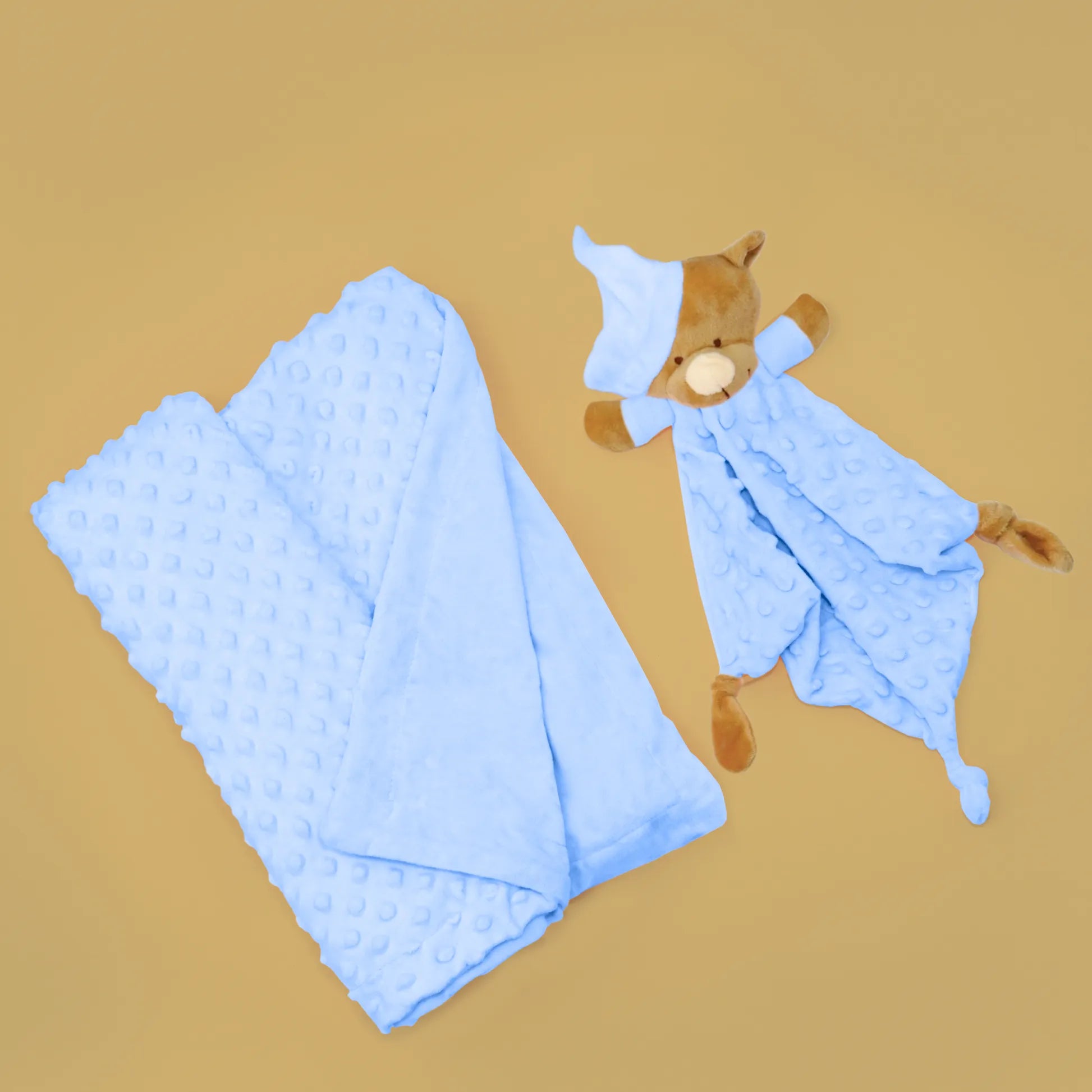 Conjunto de manta y doudou osito con detalles en relieve azul