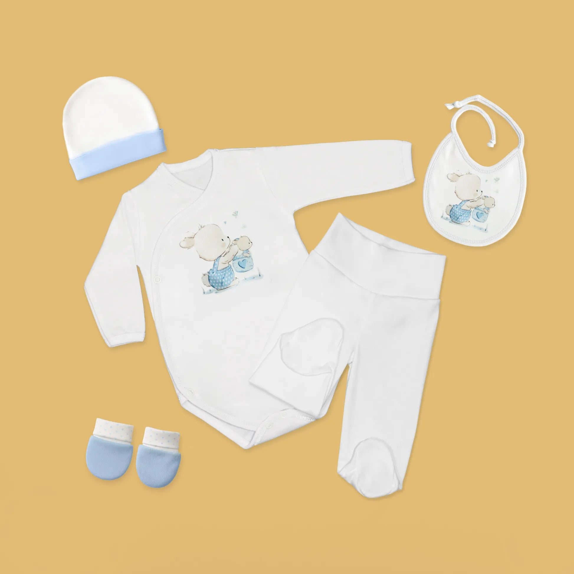 Conjunto de primera puesta con motivo de conejito en la cesta azul