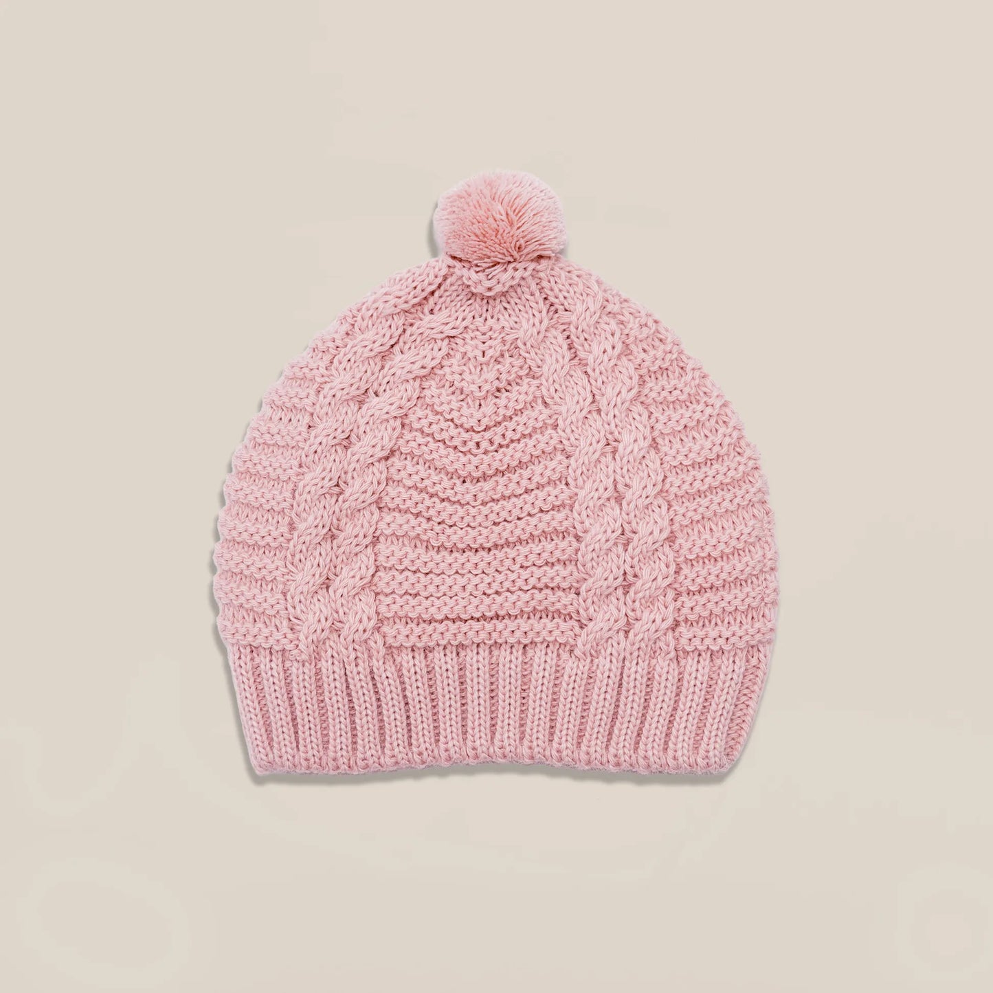 Gorro de punto trenzado con pompón rosa