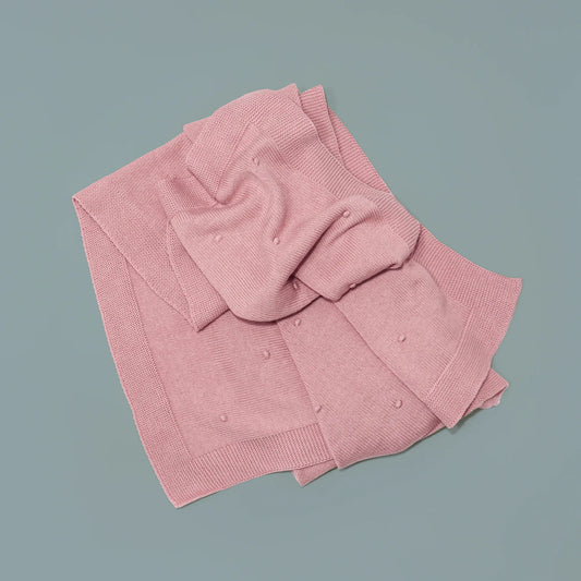 Manta de punto con relieve de pompones rosa