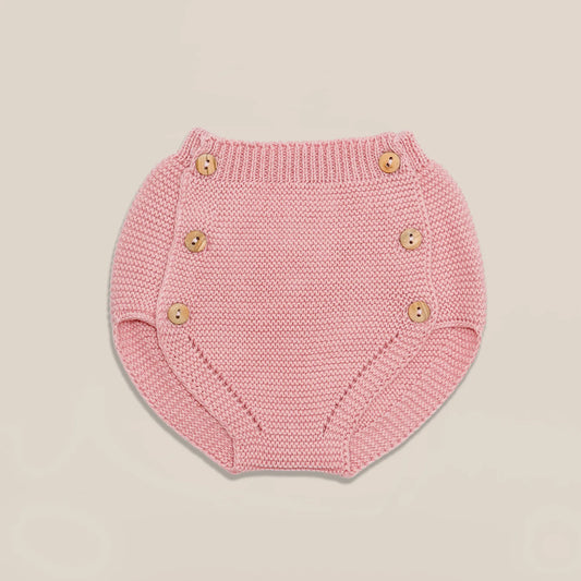 Cubrepañal de punto con botones de madera rosa